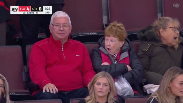 Geraldine Tkachuk reacts with surprise after a big fight in an NHL game